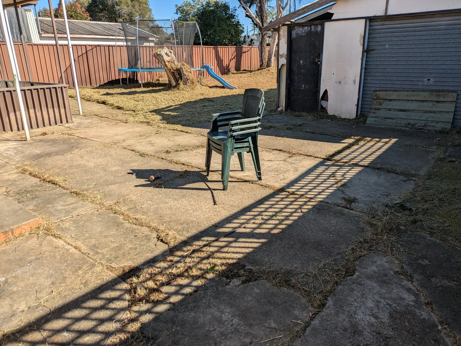 Front of garage and trampoline area after clean-up